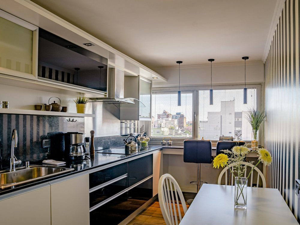 A finished kitchen with open shelving